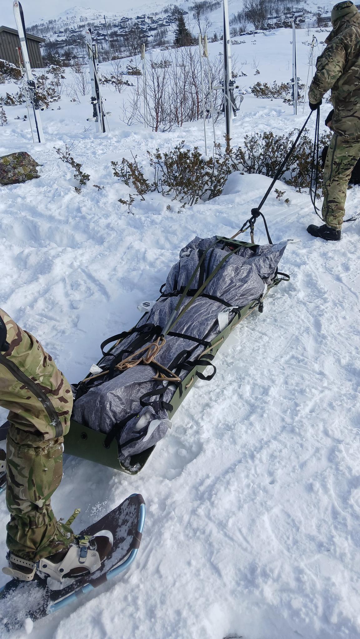 Winter tactical medical evacuation training with ski-equipped personnel in arctic mountain terrain